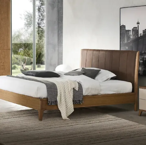 Letto Nirvana in legno con testiera in pelle di Le Fablier